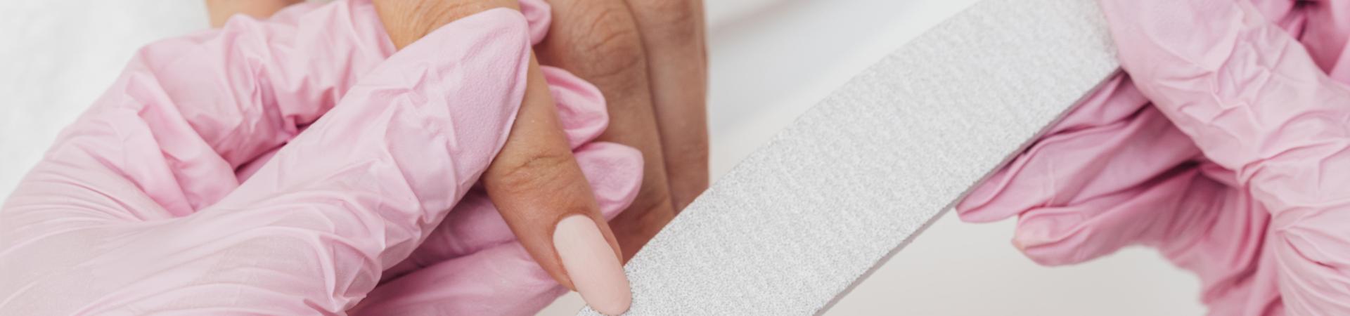 nail-hygiene-care-beautician-wearing-gloves-close-up