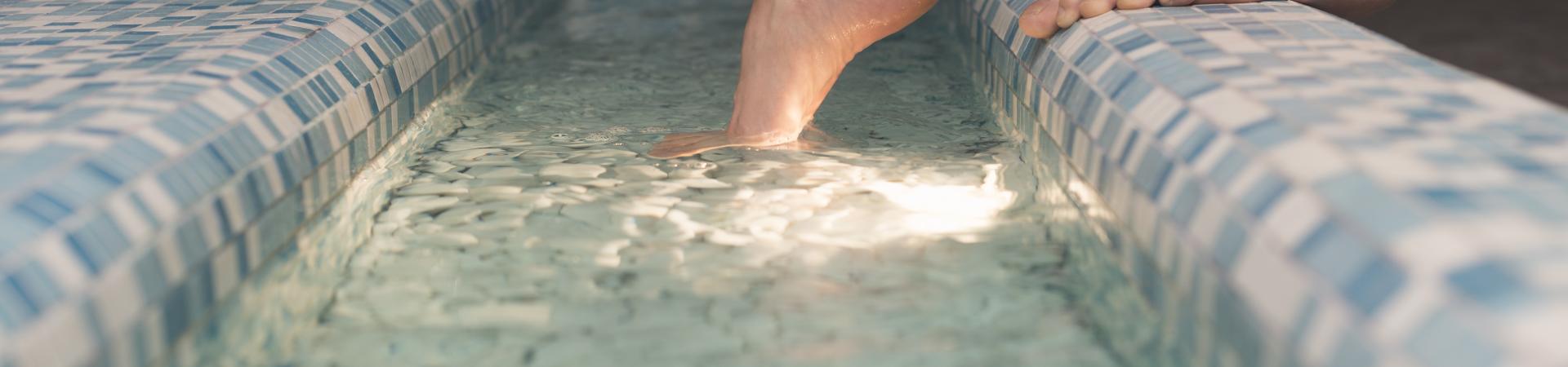woman-s-feet-edge-bathtub